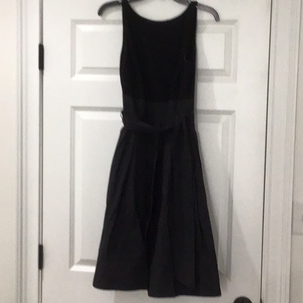 Lauren sleeveless black dress with taffeta skirt.